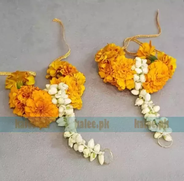 Image of elegant earrings adorned with marigold and jasmine motifs