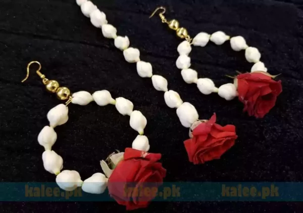 Image displaying red rose flower earrings and Bindya accompanied by jasmine motifs