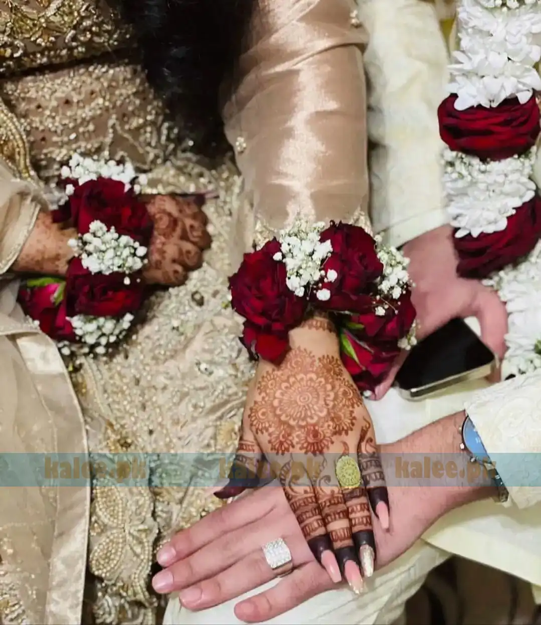 Red Rose Bridal Kangan With Baby Breath flowers arranged on a silver bangle