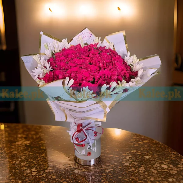 A magnificent bouquet of English red roses and statice.