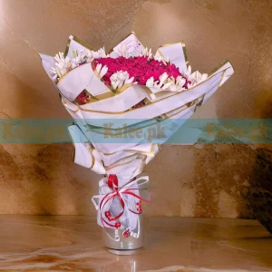 Tuberose Bouquet with fragrant white tuberose and deep red roses, wrapped in decorative paper and finished with a satin ribbon.