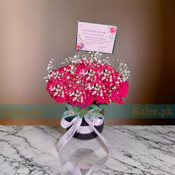 A charming box of red roses with baby’s breath.