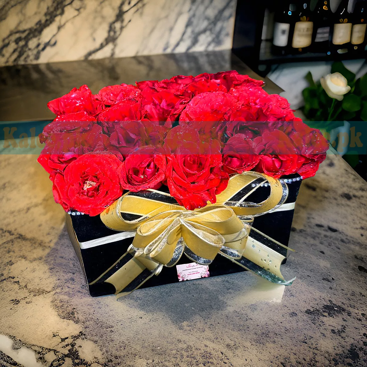 A box containing English red roses.