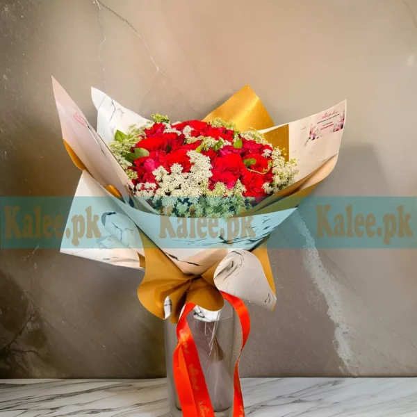 A bouquet of English red roses with lacy accents.