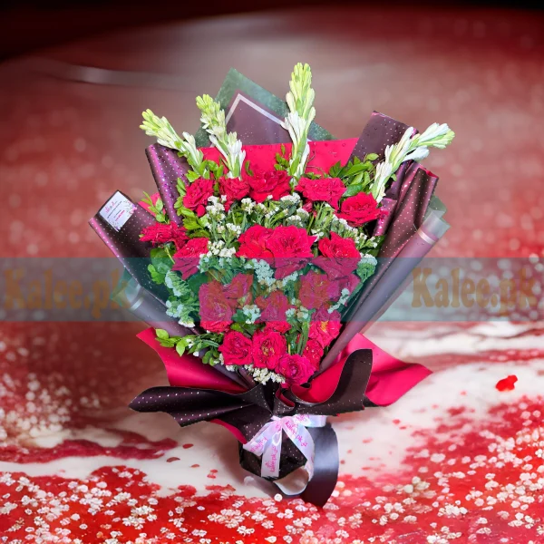 A gorgeous bouquet of English red roses, tuberose, and lacy flowers.