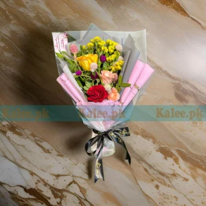 Rose Flowers Bouquet with red, pink, and yellow roses, accented with statice flowers and wrapped in elegant paper.