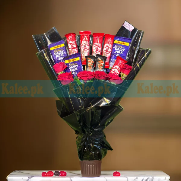 A bouquet with red roses and chocolates.