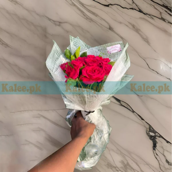 English Red Rose Flowers bouquet with fresh, vibrant red roses, wrapped in decorative paper and finished with a satin ribbon.