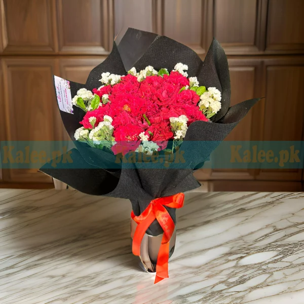 A beautiful bouquet of red roses and statice.