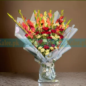 Flowers Bouquet with red and white roses and gladiolus, elegantly wrapped in decorative paper and finished with a satin ribbon.