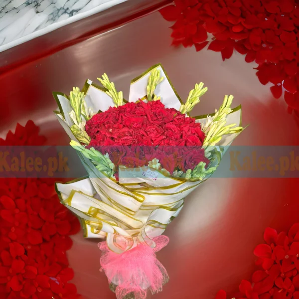 A sophisticated bouquet of English red roses and statice.