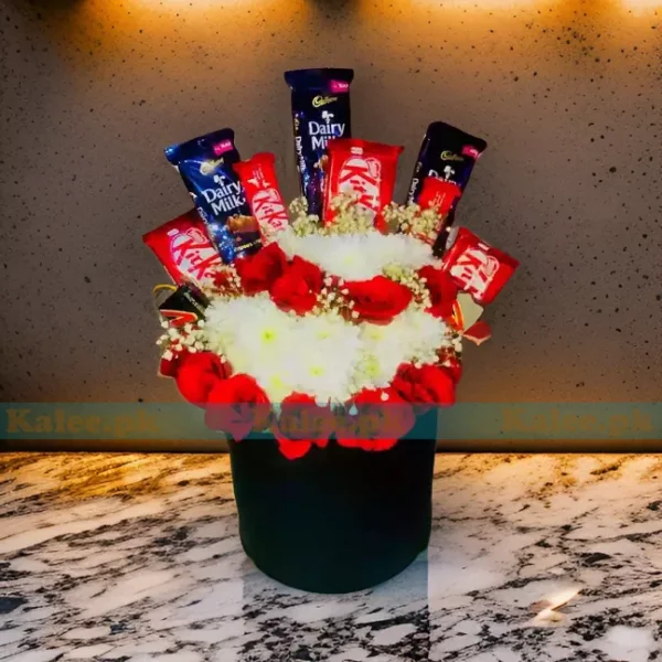 A bouquet featuring a delightful blend of red roses, daisies, baby's breath, and chocolates