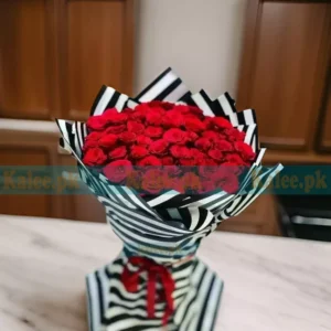 A bouquet featuring beautiful red rose flowers in a simple arrangement