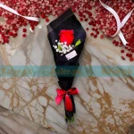 Single red rose flower with delicate Baby's Breath.