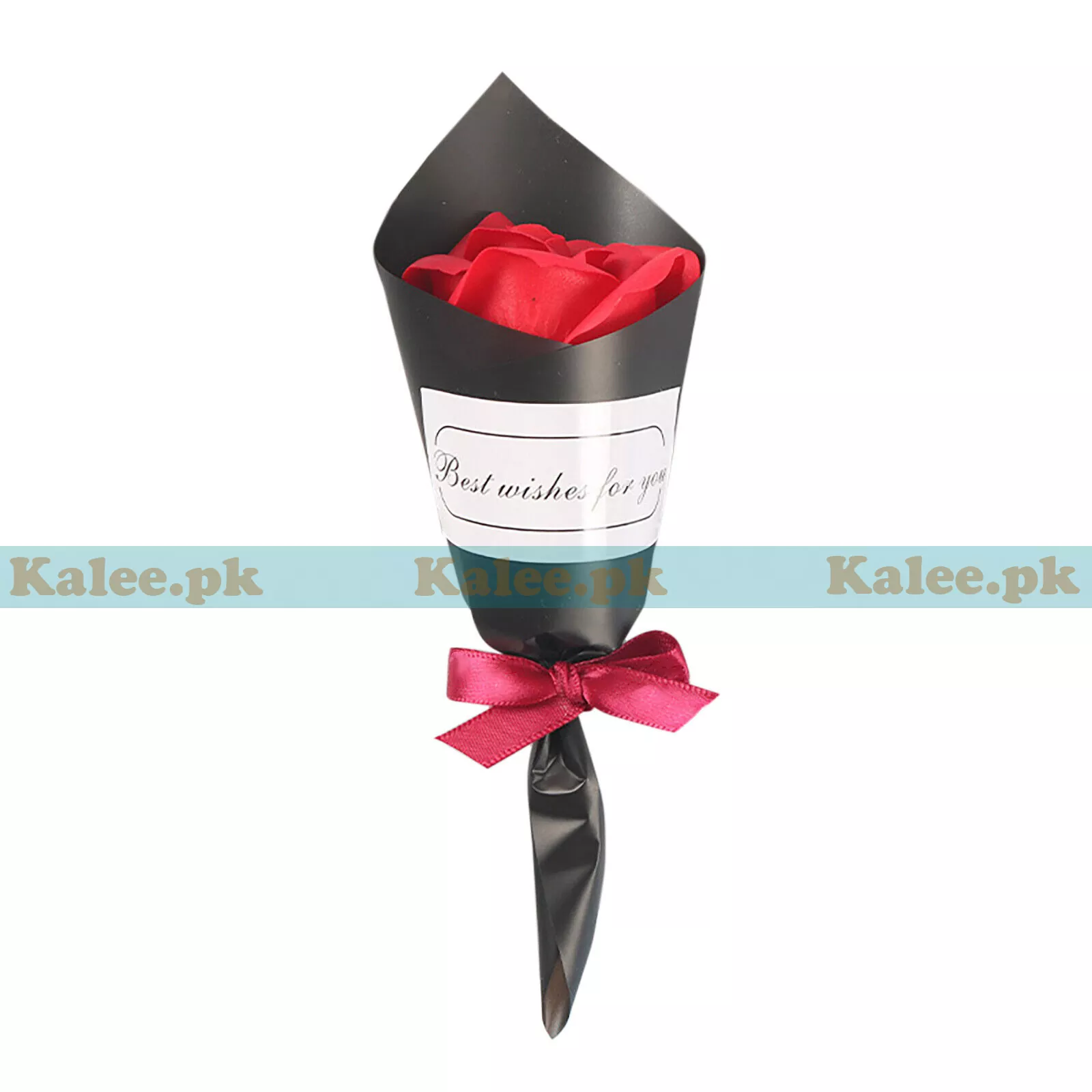 A single red rose elegantly wrapped in black paper.