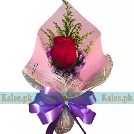 A single red rose presented in chic and stylish wrapping.