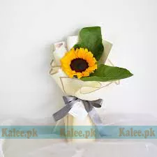 A single sunflower elegantly wrapped in classic paper.