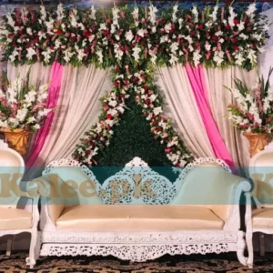 Stage adorned with white glades and red rose flowers decoration