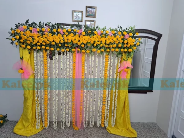 Stage adorned with modern design marigold flowers decoration