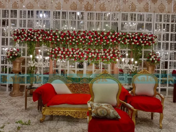 Stage adorned with white and red rose flowers decoration