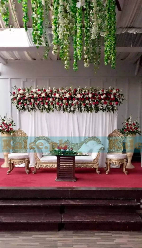 Stage adorned with glades and daisy flowers