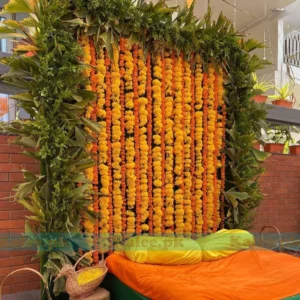 Stage adorned with orange and yellow marigold flowers decoration