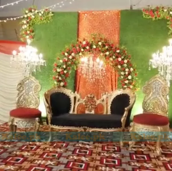 Wedding stage adorned with stylish roses and glades decoration