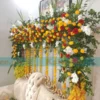 Stage adorned with white glades and daisy flowers