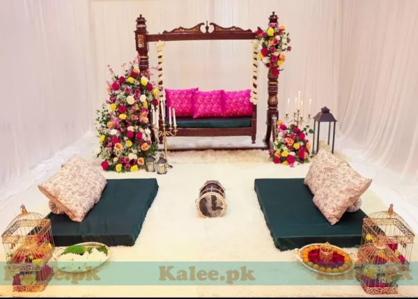 Stage adorned with red roses and baby's breath flowers decoration
