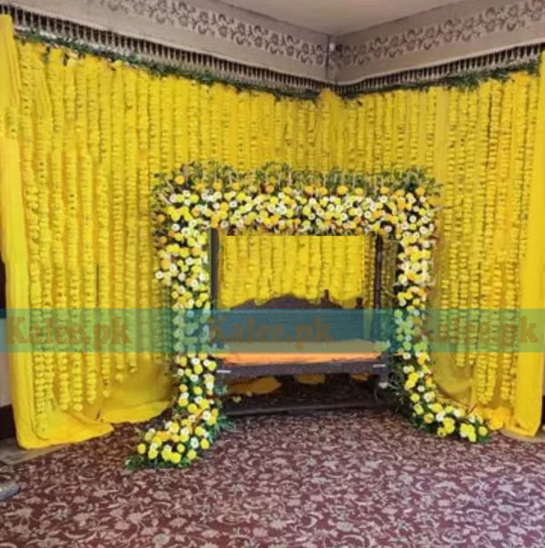 Stage adorned with luxury and classic marigold flowers decoration