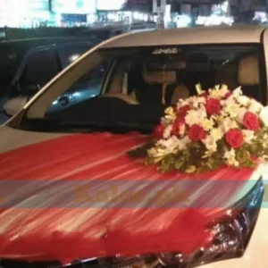 Wedding car adorned with roses, glades, and tuberose decent decoration.