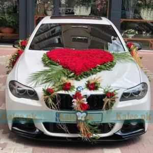 A luxurious car adorned with stylish red roses.