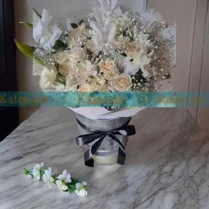 A charming Glades Flowers Box with Baby's Breath, featuring creamy white roses and gladiolus in an elegant floral arrangement.