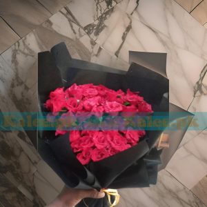 A stunning Flowers Bouquet featuring elegant English red roses wrapped in sleek black paper for a sophisticated touch.