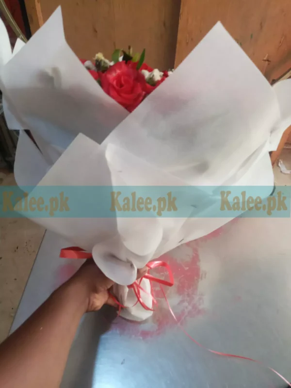 Bouquet of red roses and tuberose with glade flower