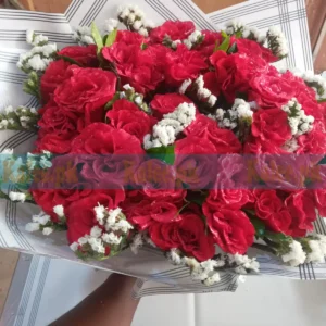 Bouquet of red roses with chocolates