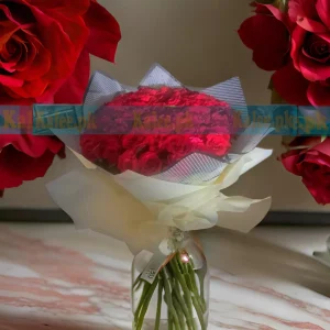 Fancy bouquet of black wrapped English red roses