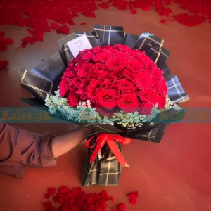 A luxurious bouquet featuring 150 red roses arranged in a sophisticated manner