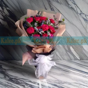 A beautifully arranged Flowers Fancy Bouquet, featuring fresh red roses and delicate statice flowers for an elegant floral gift.