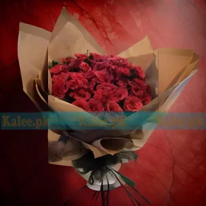 A luxurious Red Roses Fancy Bouquet, featuring fresh English red roses elegantly wrapped for a sophisticated floral gift.