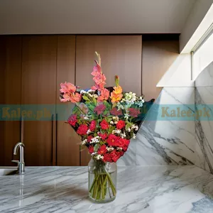 A bouquet featuring English red roses complemented by glades and statice flowers
