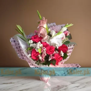 A bouquet featuring a blend of glades, English red roses, and statice flowers