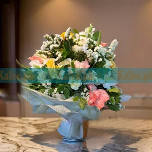 A stunning Statice Flowers Bouquet, featuring fresh roses, elegant glades, fragrant tuberose, and delicate statice flowers for a graceful floral arrangement.