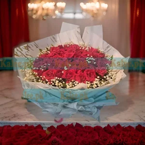 A charming Baby's Breath Flowers Bouquet, elegantly arranged with fresh red roses for a timeless and romantic floral gift.