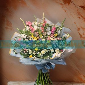 A vibrant Flowers Bouquet, featuring a stunning mix of glades, tuberose, statice, and roses for a grand and elegant floral gift.