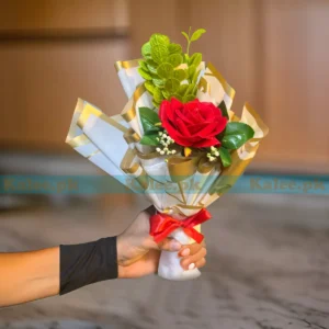 A breathtaking artificial single red rose flower bouquet, exuding timeless beauty