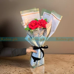 A lifelike artificial bouquet featuring stunning red roses