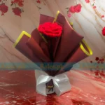 A blissful crochet bouquet of red roses, meticulously handcrafted, offering floral serenity for romance