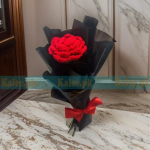 A unique handmade crochet bouquet featuring custom red rose flowers