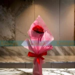 A cherished crochet bouquet adorned with beloved handcrafted red roses